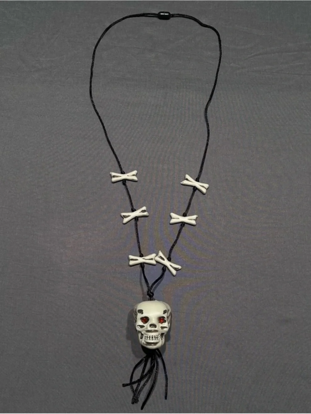 Greenbrier International Plastic Skull and Crossbones Cord Necklace